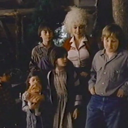 Dolly with the dwarves--err--orphans.