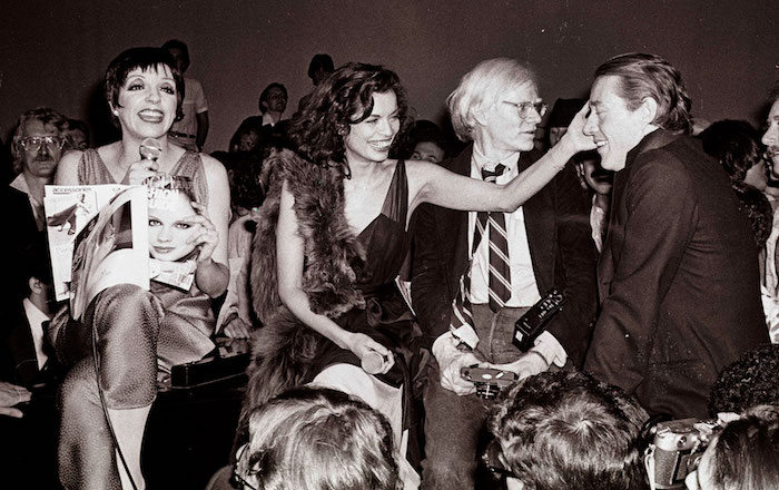 From left: Liza Minnelli, Bianca Jagger, Andy Warhol, and Halston at Studio 54. Photographer: Adam Scull. 