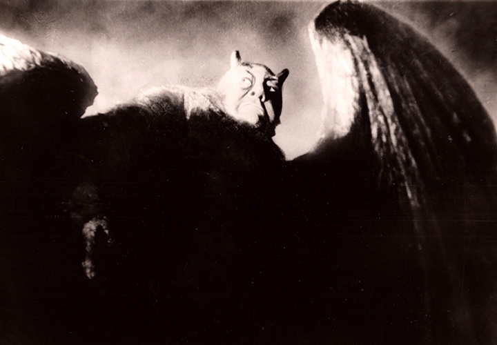 Mephisto (Emil Jannings) shrinks from the heavenly light in 'Faust.' Photo credit: Kino